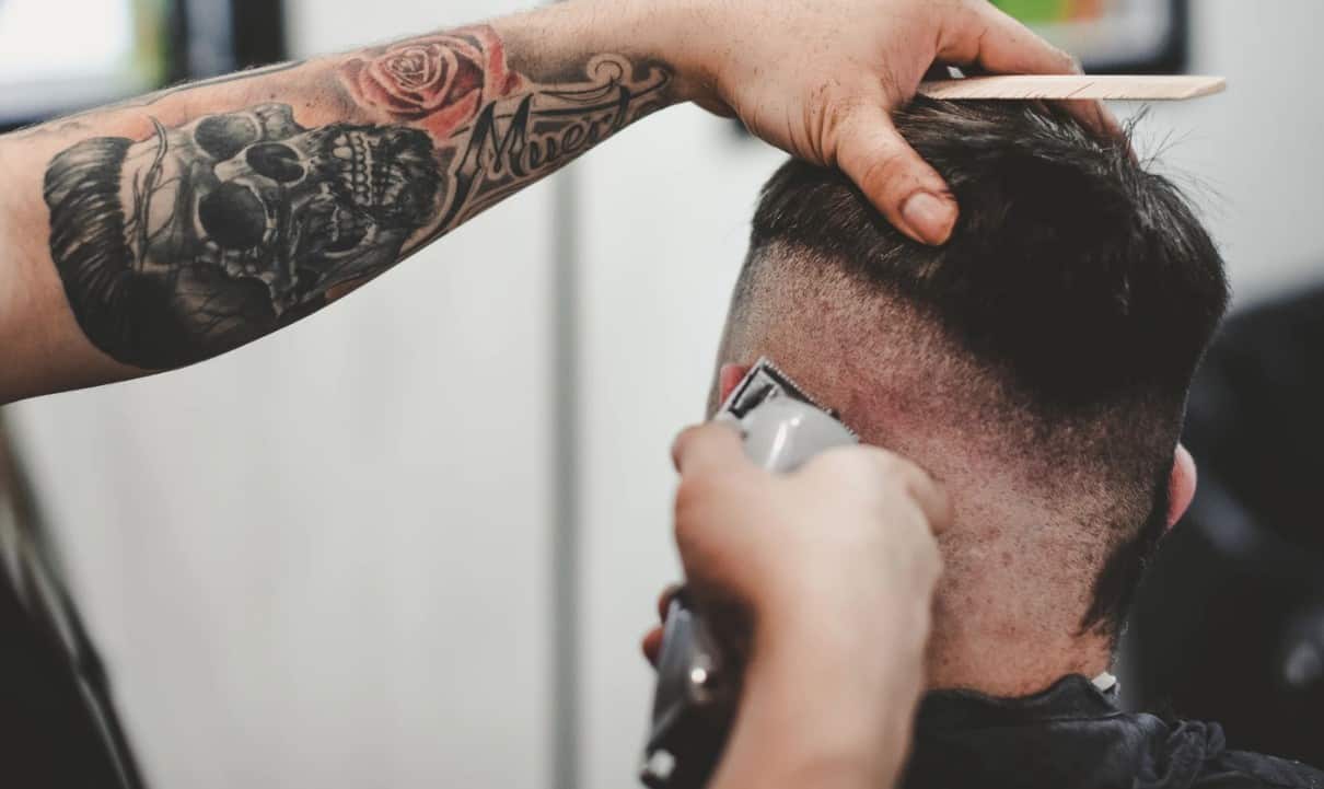 man using the best hair clippers to cut hair