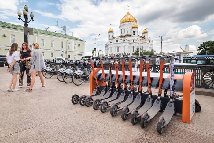 row of electric scooters