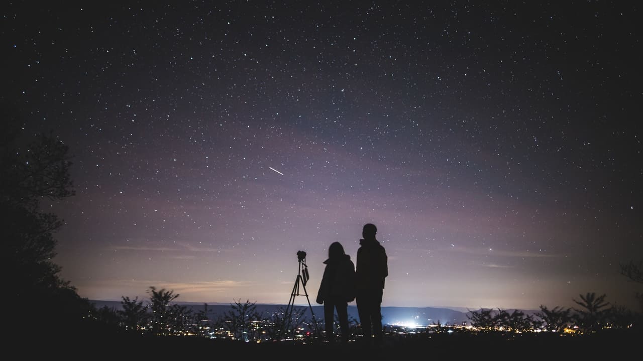 two person standing under stary sky using the best telescope