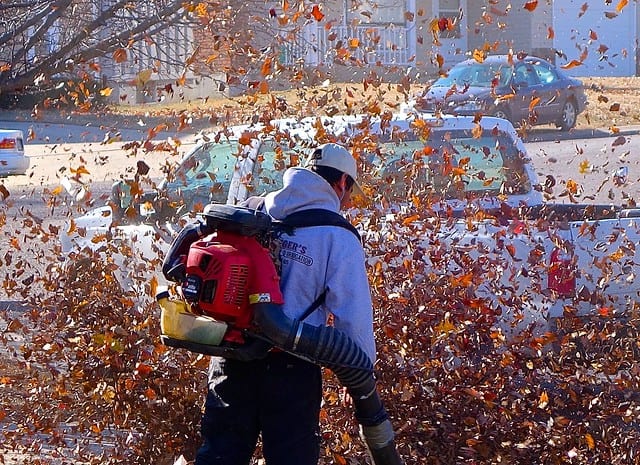 a man using a leaf blower