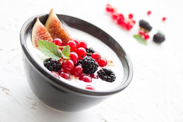 a bowl of yogurt with fresh fruit toppings